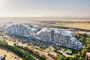 Aerial view of contemporary Dubai residences and landscaped grounds